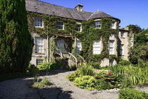 Ireland, County Carlow, Tullow, Altamont Garden and house, The house with shrubs in the foreground.
