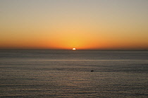 Malta, Sliema, Mediterranean sunrise and small fishing boat.