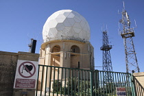 Malta, Dingli, Clifftop radar station with sign warning people with heart pacemakers of danger.