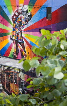 USA, New York, Manhattan, colourful mural by Brazilian street artist Kobra depicting the photograph by Alfred Eisenstaedt titled V-J Day in Times Square beside the High Line linear park on 25th Street...