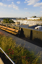USA, New York, Manhattan, deserted northern section of the High Line linear park on the disused elevated West Side Line railroad beside the Hudson Rail Yards with trains in Midtown.