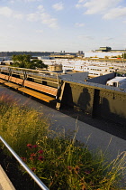 USA, New York, Manhattan, deserted northern section of the High Line linear park on the disused elevated West Side Line railroad beside the Hudson Rail Yards with trains in Midtown.