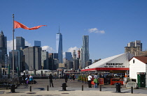 USA, New York, Brooklyn Bridge Park, Fulton Ferry Pier with Lower Manhattan skyscraper skyline beyond.