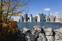 USA, New York, Lower Manhattan skyline skyscrapers and East River seen in autumn from Brooklyn Bridge Park.