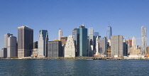USA, New York, Lower Manhattan skyscraper skyline and East River seen from Brooklyn Bridge Park.