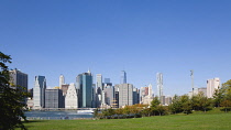 USA, New York, Lower Manhattan skyscraper skyline and East River seen from Brooklyn Bridge Park.