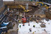 USA, New York, Manhattan, overview of construction site with workers at the foundation level.