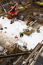 USA, New York, Manhattan, overview of construction site with workers at the foundation level.