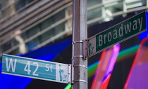 USA, New York, Manhattan, Road signs at the junction of Broadway and 42nd Street in the Theater District.