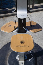 USA, New York, Brooklyn Bridge Park, AT&T solar panel Street Charger for mobile phones.