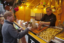 Ireland, North, Belfast, Christmas international food market in the grounds of the city hall.