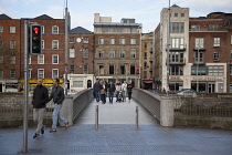 Ireland, Dublin, Footbridge across River Liffey viewed from the Temple Bar side.