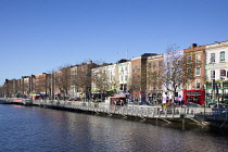 Ireland, Dublin, View along the River Liffey with colourful buildings on the northside..