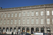 Ireland, Dublin, Trinity College buildings on College Green, Tourists queuing to enter the library to see the Book of Kells.