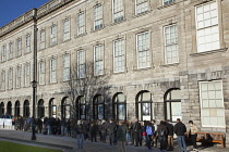 Ireland, Dublin, Trinity College buildings on College Green, Tourists queuing to enter the library to see the Book of Kells.