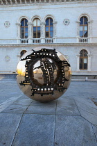 Ireland, Dublin, Trinity College, Arnaldo Pomodoro's Sphere within a Sphere sculpture outside the Berkeley Library.