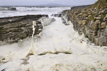 Ireland, County Sligo, Streedagh,  Foam being generated by stormy seas.