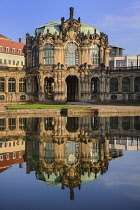 Germany, Saxony, Dresden, Zwinger Palace, Glockenspiel Pavilion reflected in pool.