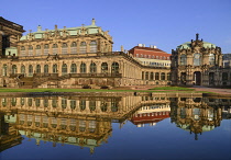 Germany, Saxony, Dresden, Zwinger Palace, Glockenspiel Pavilion reflected in pool.