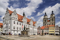 Germany, Saxony Anhalt, Lutherstadt Wittenberg, Marktplatz with the Rathaus and Pfarrkirche St Marien in the background, the Pfarrkirche St Marien is also known as Stadtkirche and St Marys.