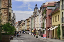 Germany, Saxony Anhalt, Lutherstadt Wittenberg, Colourful vista of buildings in Collegienstrase