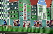 Netherlands, Noord Holland, Zaandam, Zaandam Town Hall, General view of the building with pedestrian walkway and murals in the foreground.