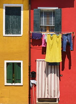 Italy, Veneto, Burano Island, Colourful row of house facades.