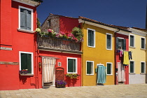 Italy, Veneto, Burano Island, Colourful row of house facades.