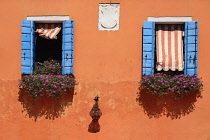 Italy, Veneto, Burano Island, Colourful row of house facades.