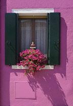 Italy, Veneto, Burano Island, Colourful row of house facades.