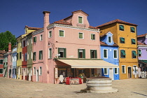 Italy, Veneto, Burano Island, Colourful row of house facades.