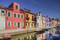 Italy, Veneto, Burano Island, Colourful housing on Fondamenta Cao di Rio a Destra.
