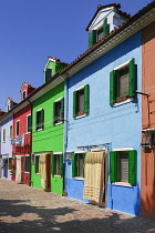 Italy, Veneto, Burano Island, Colourful row of house facades.