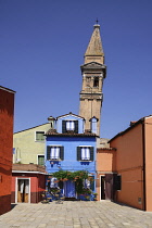 Italy, Veneto, Burano Island, The Leaning tower of Chiesa di San Martino fronted by colourful houses.
