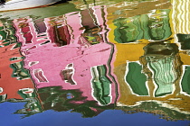 Italy, Veneto, Burano Island, Colourful reflections on Fondamenta Pontinello Sinistra.