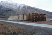 Norway, Svalbard, Pyramiden, Russian settlement, Accommodation blocks at Pyramid built from locally made bricks, Block in the foreground is wooden-clad to improve insulation, Pyramid mountain, coal mi...