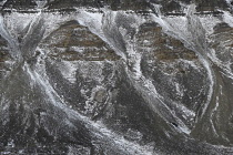 Norway, Svalbard, Longyearbyen valley side, Scree slopes, strata and snow.
