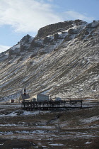 Norway, Svalbard, Longyearbyen.Svalbard Church, Kirke, remains of original settlement at Longyearbyen, remains of colliery aerial cable way along valley side.