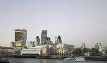 England, London, The Modern skyline of the City with The Walkie Talkie Building, The Gherkin, The Cheesegrater viewed over River Thames at dusk.