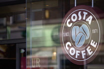 Business, Food & Drink, Catering, Costa Coffee shop sign in the window of a high street outlet. **Editorial Use Only**