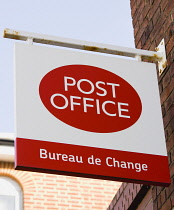 Business, Finance, Money, Post Office Bureau de Change foreign exchange sign on the wall of a Post Office building.