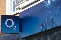 Business, Shops, Telecommunications, O2 mobile network cell phone shop sign on a high street shop. **Editorial Use Only**
