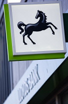 Business, Finance, Banking, Lloyds black horse sign and logo on a high street bank building.