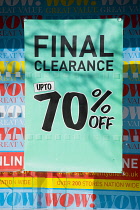 Business, Shops, Shopping, Final Clearance Sale sign with upto 70% off in the window of a high street shop.