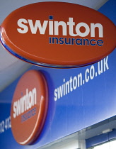 Business, Finance, Insurance, Swinton Insurance sign and logo on a high street bank building.