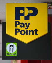 Business, Finance, Money, shop sign for PayPoint for paying utility bills and Top-up for topping up mobile phones. **Editorial Use Only**
