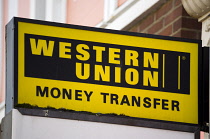 Business, Finance, Money, Western Union Money Transfer sign on a shop. **Editorial Use Only**