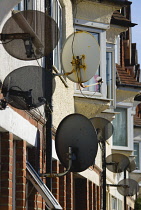 Communications, Media, Television, satellite dishes on the front of terraced houses.
