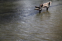 Climate, Weather, Flooding, Bench in flooded public park.