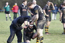 Sport, Ball, Rugby, Injured player receiving medical attention.
